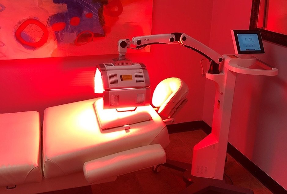 POLY Pro 5-panel LED head delivering red light therapy in a treatment room